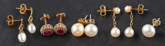 Four pairs of earrings and an ear stud, including a pair of ruby and diamond cluster earrings,
