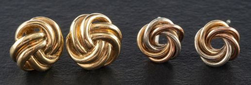 Two pairs of knot ear studs, both with post fittings,the larger pair stamped '375', diameter ca.