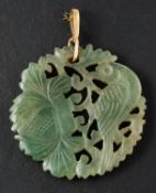 A circular, carved jade pendant, depicting pheasant and foliage, diameter ca. 3.