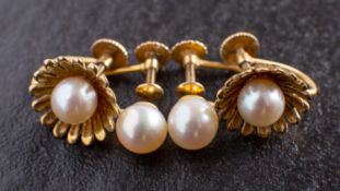 Two pairs of cultured pearl ear clips, including a 9ct gold pair of flowerhead design,
