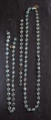 Three chains of round, mixed-cut spectacle-set blue zircons, lengths ca.