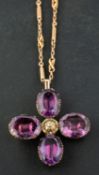 A 19th century, quatrefoil, foil backed amethyst pendant, together with a fancy-link chain,