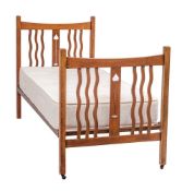 A pair of oak single beds in Arts and Crafts style,
