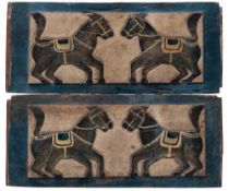 A pair of Indonesian polychrome carved wood door panels each decorated with opposing horses,