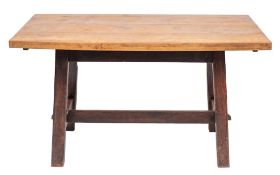 An oak trestle table in Arts & Crafts taste,