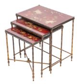 A nest of three metal and lacquered wood rectangular occasional tables,