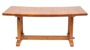 A stained molave wood trestle table,
