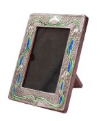 A sterling silver and enamel photo frame, stamped Sterling in the Art Nouveau taste,
