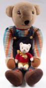 A large blonde plush Teddy bear, together with a small Rupert bear and a boxed Stylophone.