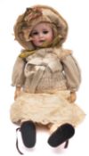 A Max Handwerck Bebe Elite Bisque Head Doll, applied blonde wig , brown glass sleeping eyes,