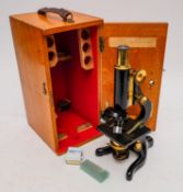A black lacquer 'Kima' microscope by Watson & Son, London: No. 58046.