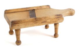 A 19th Century fruitwood mandolin of rectangular shape with diagonal blade, on four turned legs,