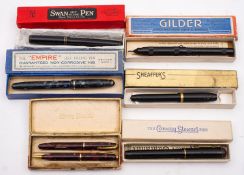 A Conway Stewart red marbled 6550 'Dinkie' fountain pen and propelling pencil set in original box: