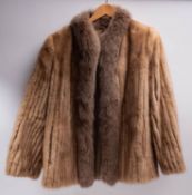 A mid 20th century mink fur coat: size 14 label to nape,