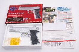 A CyberGun Colt Double Eagle 6mm BB gun, boxed.