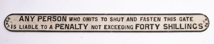 A reproduction LNER 'Any Person Who Omits to Shut and Fasten This Gate' sign', 101.5 x 9.5cm.