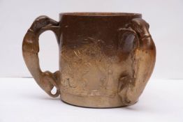 A 19th century stone ware hunting tyg with sprigged decoration to body and relief moulded greyhound