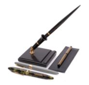 A Shaeffer Pen Co green marbled lever fountain pen, with 14k gold nib,