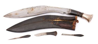 A horn and whitemetal mounted kukri, the blade of traditional form with scroll shaped back edge,