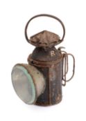 A LSWR hand lamp, black lacquer body with double rotating shades and original burner stamped 'SR'.