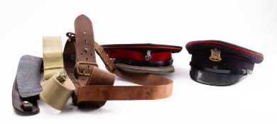 A Royal Devon Yeomanry Artillery peaked cap, together with a Dorset Regiment peaked cap,