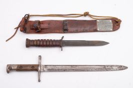 An Italian 1891 pattern bayonet stamped 'B142 to hilt with two piece wooden grip,