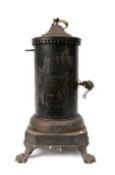 A 19th Century Continental clockwork spit engine in cylindrical blackened metal casing surmounted