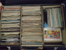 A large collection of postcards in two cases, GB topographical, humor and other subject matter.