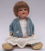 An Armand Marseille bisque head doll, applied brown wig, blue glass sleeping eyes,