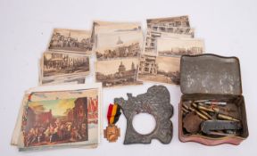 A WWI Belgian Cross of Fire, together with a French WWI pewter commemorative photograph frame,