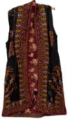 A Turkmenistan/Uzbick silk jacket of traditional design,