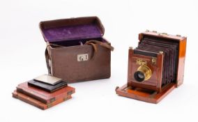 A mahogany and brass half plate filed camera by Walter Lawley, London,