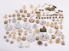 A collection of modern British Regimental cap and shoulder badges.