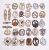 A quantity of reproduction German combat badges.