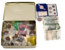 A collection of mixed coinage and notes, including five Catterns £1 notes, one Peppeiat,