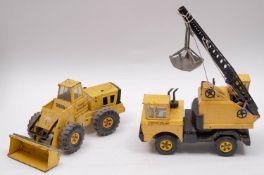 Two Tonka Toy construction vehicles, comprising 'Mighty Loader' and 'Tonka Crain' (play-worn).