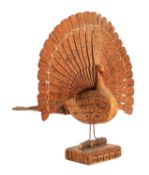 A WWII German POW wooden model of a peacock, 26cm high.