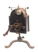A 19th Century Continental clockwork spit engine of domed outline with brass governor and bell