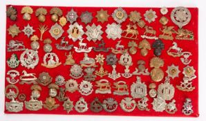 A collection of British Regimental cap badges: including The Royal Sussex Regiment,