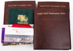 A collection of Great British decimal stamp presentation packs in three albums and loose:
