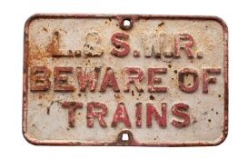 A L&SWR cast iron 'Beware of Trains' notice, 42 x 66cm.