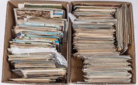 An accumulation of early to late 20th century British topographical postcards in two boxes,