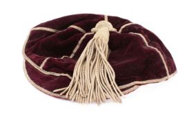 An early 20th century maroon and silver Rugby cap by W F Ferguson,