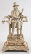 A cast iron 'Ireland' umbrella stand: the backplate depicting an 18th century Irishman wearing