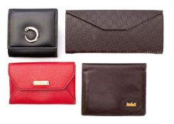 Cartier, Paris. A boxed black leather compact case with instructions and card number LL 054374.