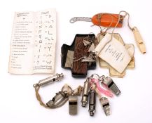 An ARP whistle by J Hudson & Co, Birmingham, together with six other various whistles, etc.