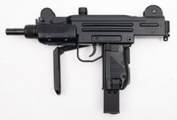 Umarex or similar. An Uzi .