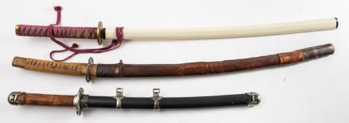A Katana style sword, the single edged blade with brass habaki and tsuba,