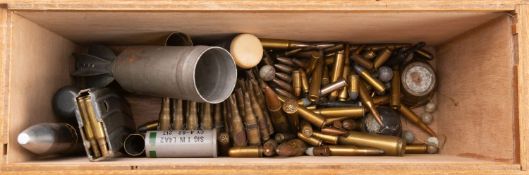 A collection of various used ordnance, including two WWI fuses,