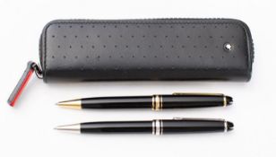 A Montblanc Meiserstuck black and gilt ball pen and similar propelling pencil in a Montblanc black